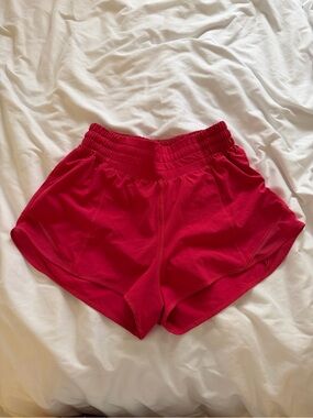High waisted LuluLemon Hotty Hot Shorts. Pink/Red Color